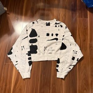 Nike Sportswear Air Crop Crew Sweatshirt featuring a black futuristic graphic.